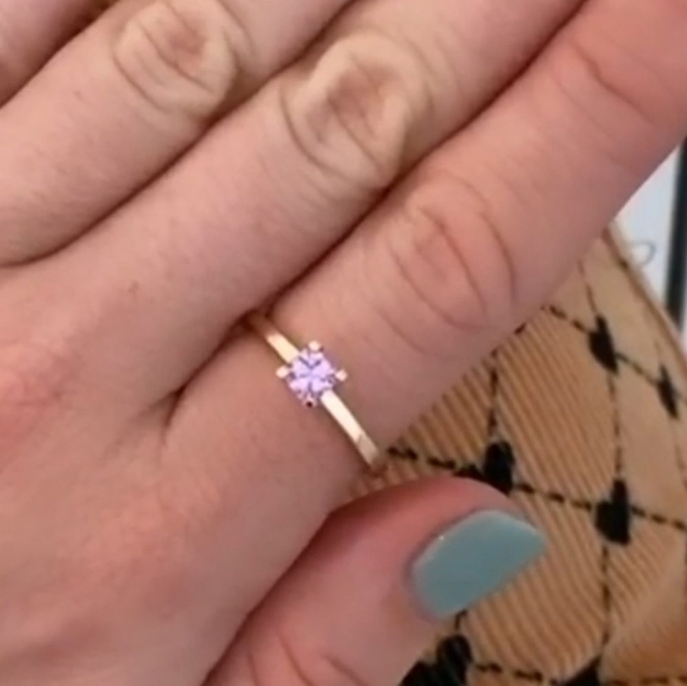 Modern and feminine asscher cut unheated purplish pink sapphire (0.63 ct)